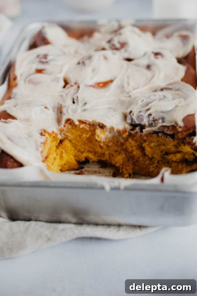 Warm Pumpkin Swirls with Brown Butter Glaze 4 tray of pumpkin spice cinnamon rolls