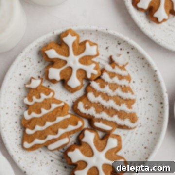 Bright Gingerbread Cookies 8 Beautifully iced gingerbread cookies arranged on a festive plate, ready for the holidays.
