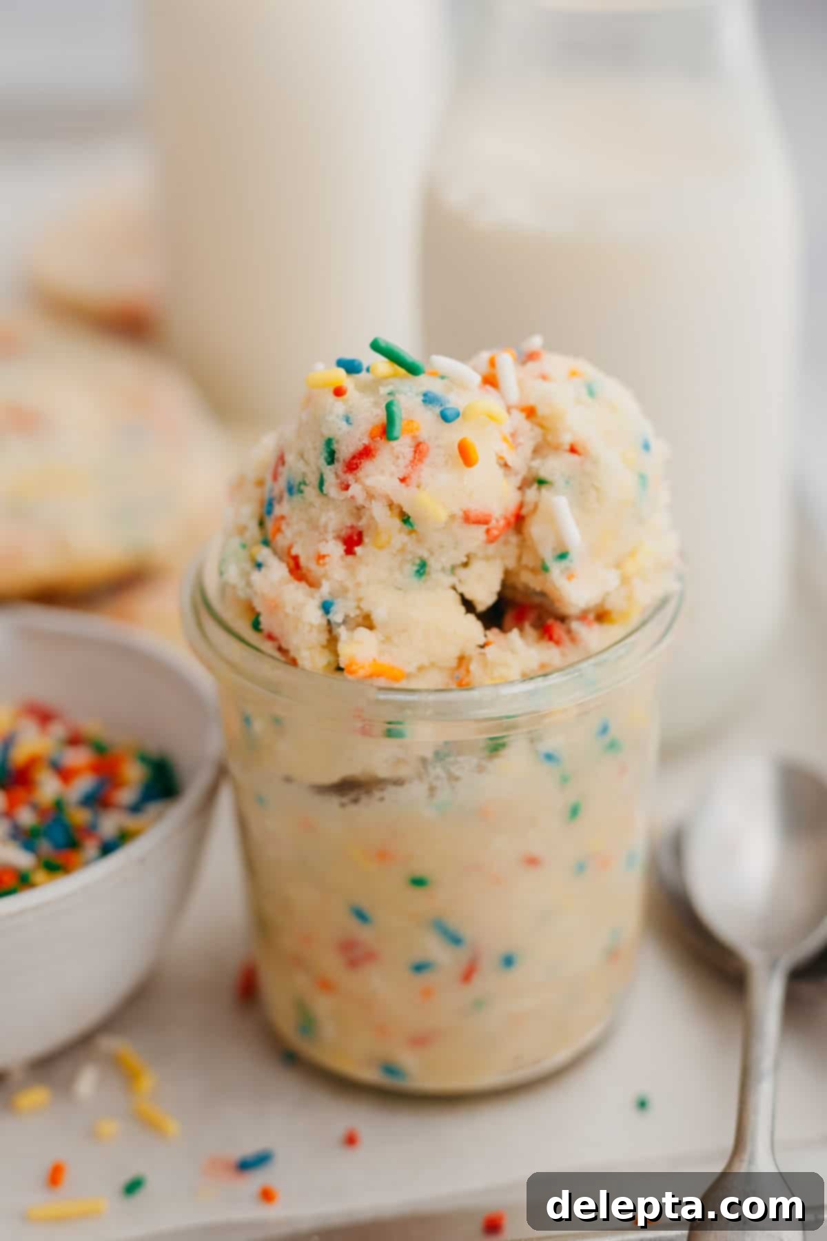 No-Bake Sugar Cookie Dough 2 Sugar cookie dough in a glass jar, perfect for a sweet treat.