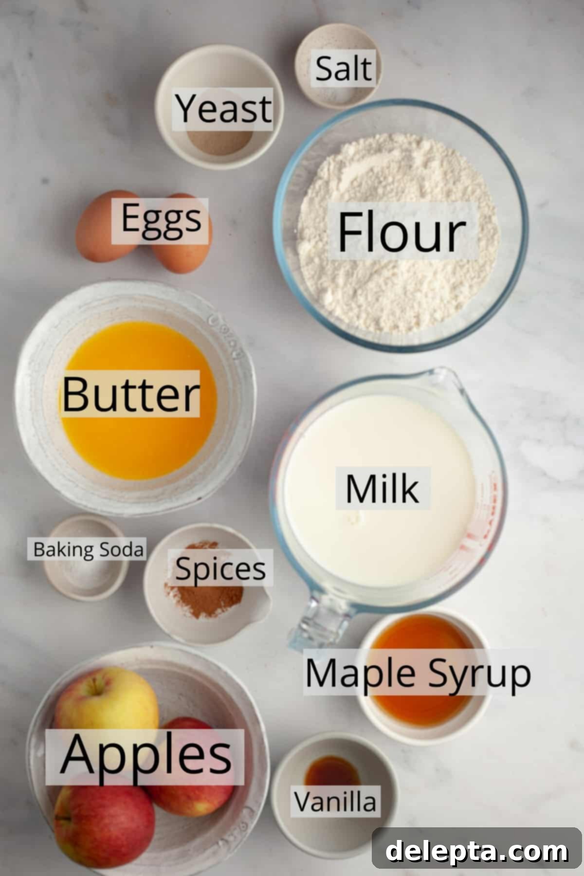 Apple Pie Waffles 3 All the ingredients neatly laid out in small bowls, ready for making apple waffles.