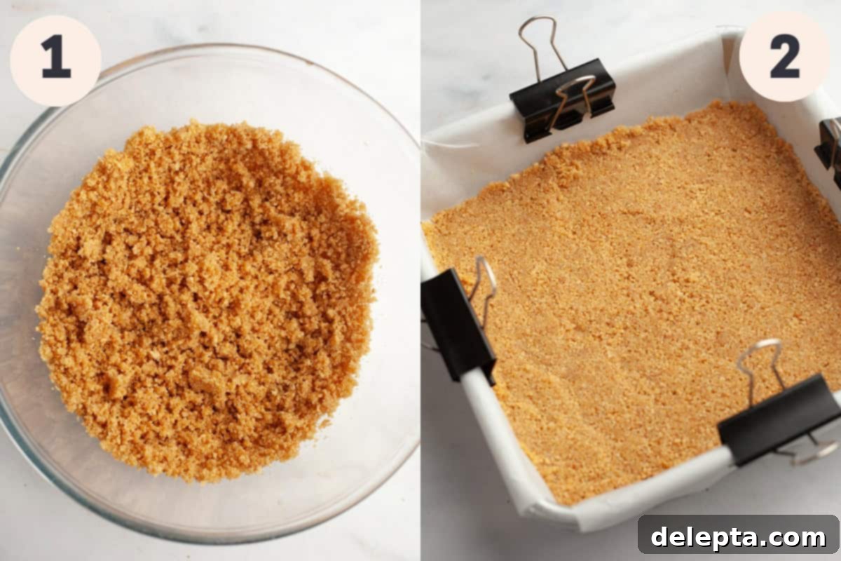 Zesty Lemon Squares with Buttery Graham Crust 4 A bowl of finely crushed graham cracker crumbs ready for mixing, alongside a square baking pan meticulously lined with parchment paper and featuring a perfectly pressed graham cracker crust, prepared for baking.