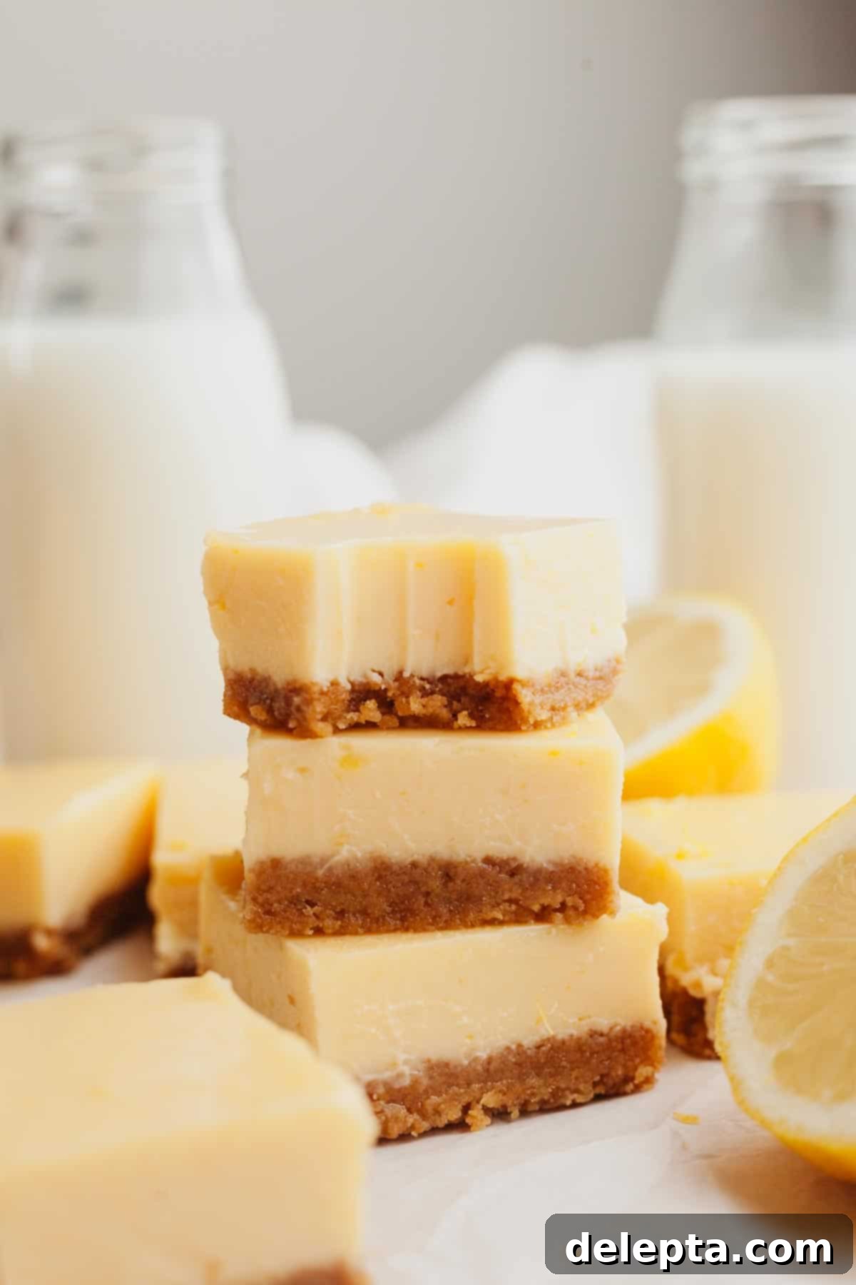 Zesty Lemon Squares with Buttery Graham Crust 7 A delectable stack of golden lemon bars with a perfectly crumbly graham cracker crust and smooth, creamy lemon filling.