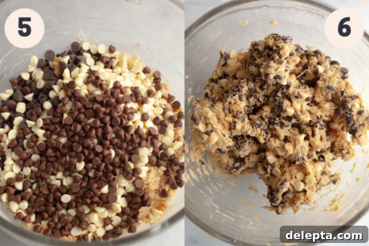 Ultimate Thick and Gooey Chocolate Lava Cookies 6 Rich cookie dough in a large glass bowl, generously studded with a mix of chocolate chips, ready for shaping.