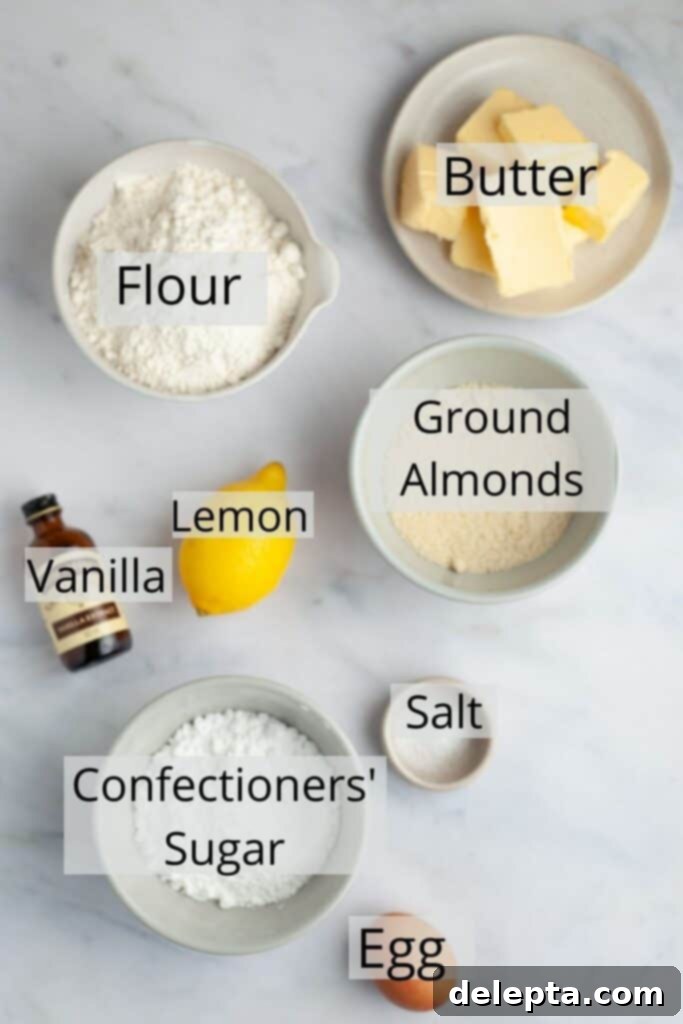 Zesty Lemon Curd Delights 4 A collection of ingredients for the linzer cookie dough, carefully measured into small bowls, featuring flour, almond flour, confectioners' sugar, butter, and an egg.