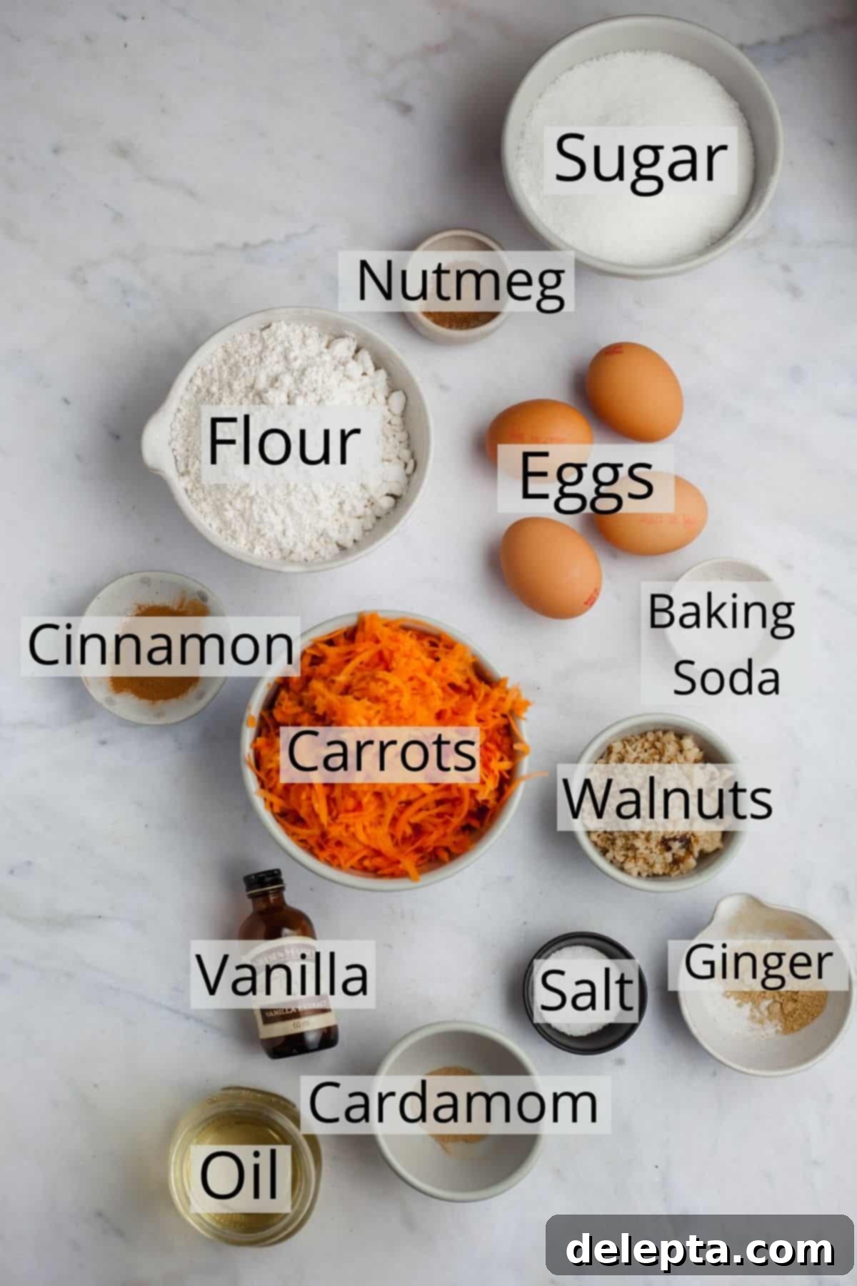 Golden Spiced Carrot Crown 3 All the pre-measured ingredients for a classic carrot bundt cake displayed neatly in small white bowls on a wooden surface.