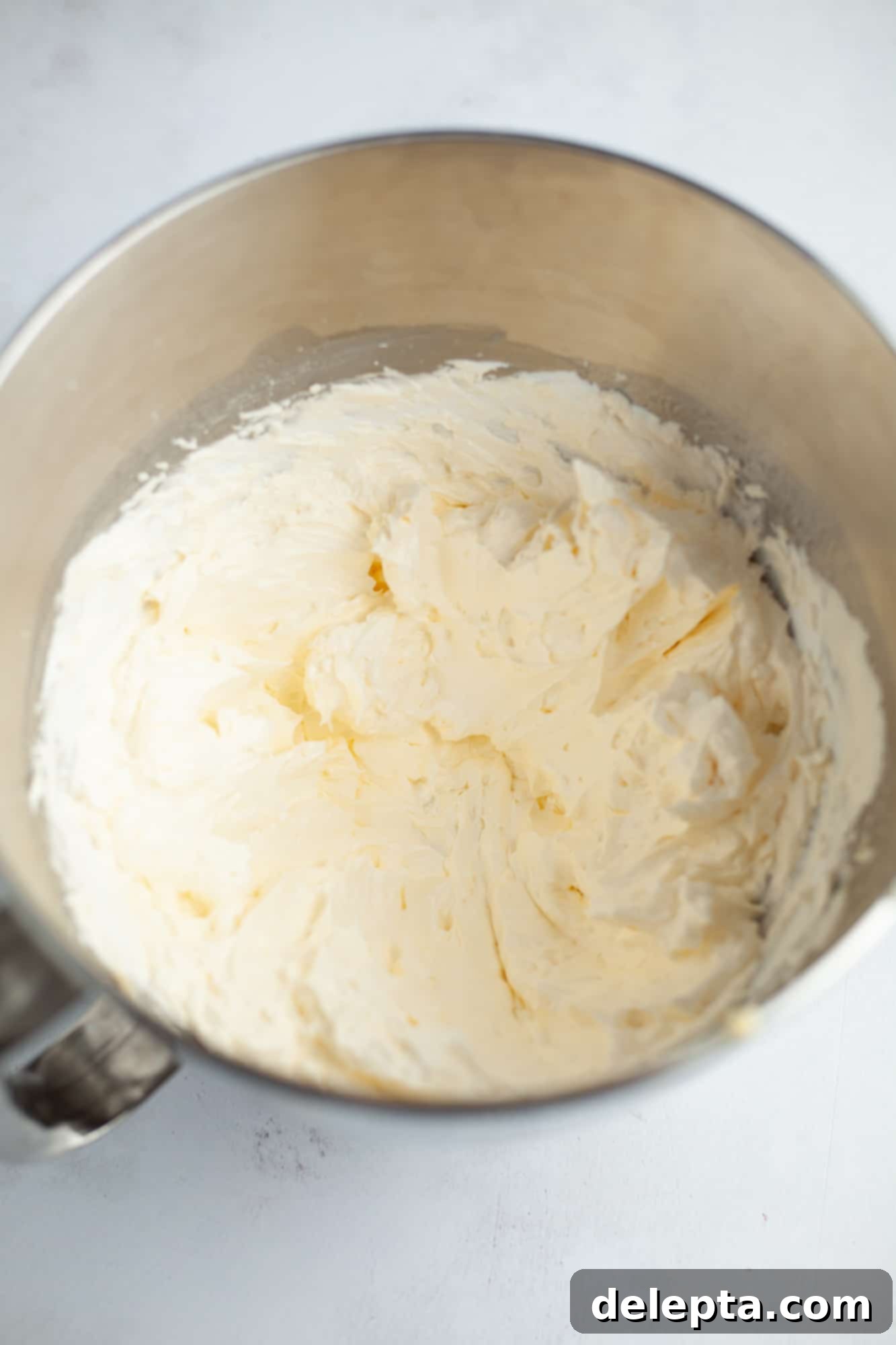 Peanut Butter Chocolate Nirvana 11 A large silver mixing bowl with swiss meringue buttercream
