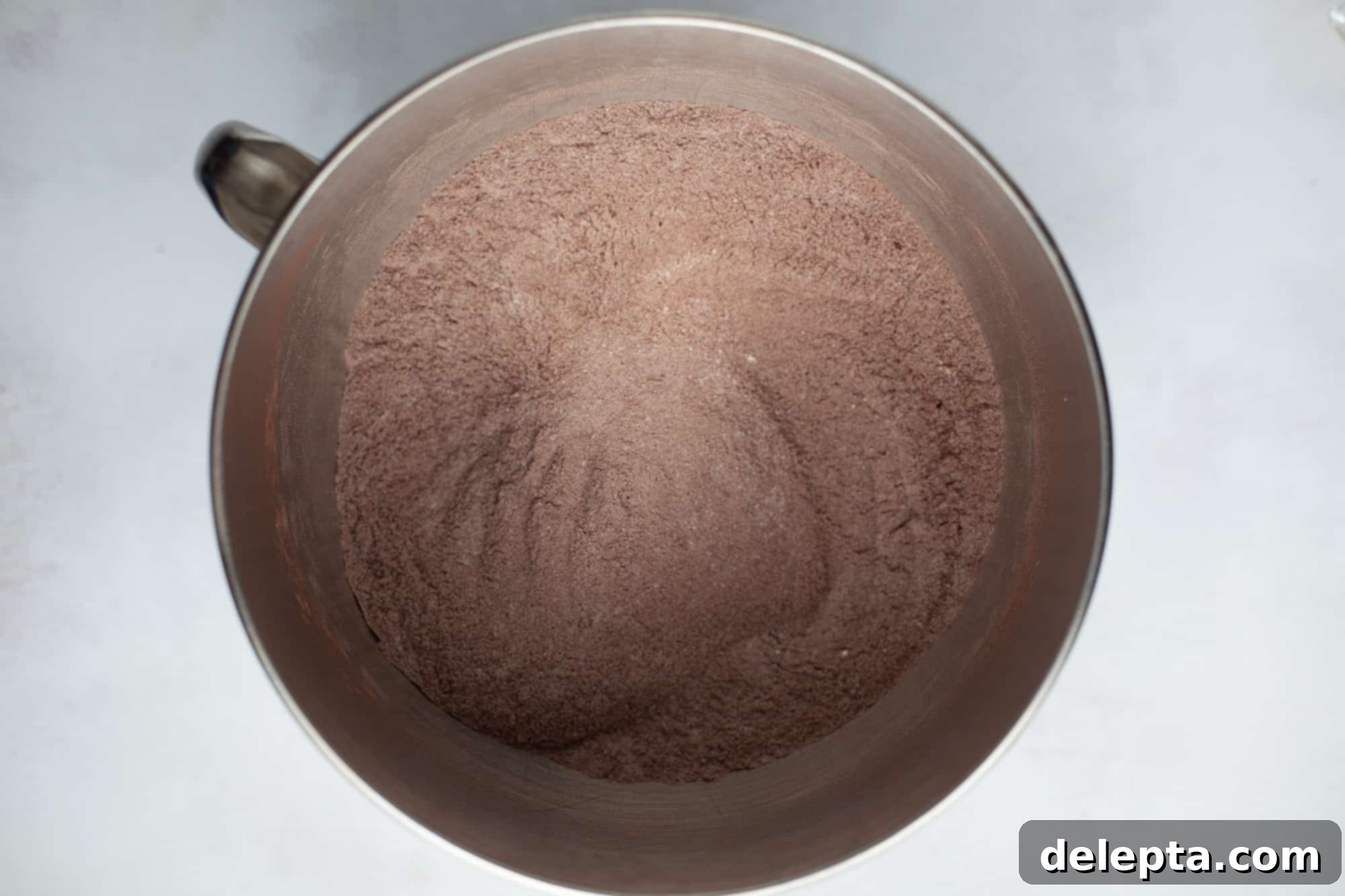 Peanut Butter Chocolate Nirvana 6 A large silver mixing bowl with a dry cocoa powder and flour mixture