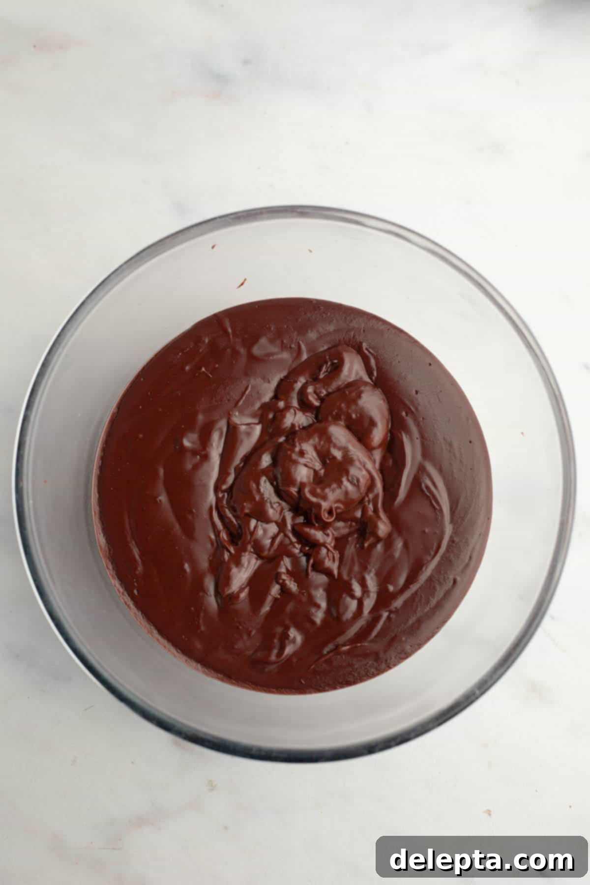 Spooky Simple Homemade Chocolate Pudding Dirt Cups 8 Chocolate pudding a glass bowl.