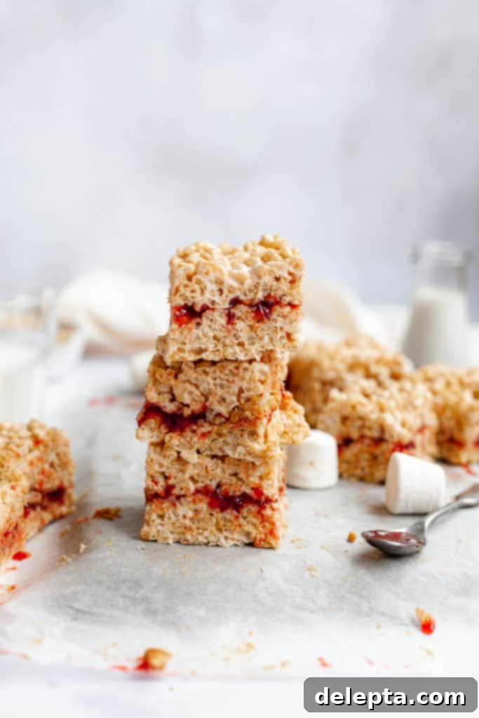 Peanut Butter Jelly Krispie Squares 2 a stack of three peanut butter and jelly rice krispie treats