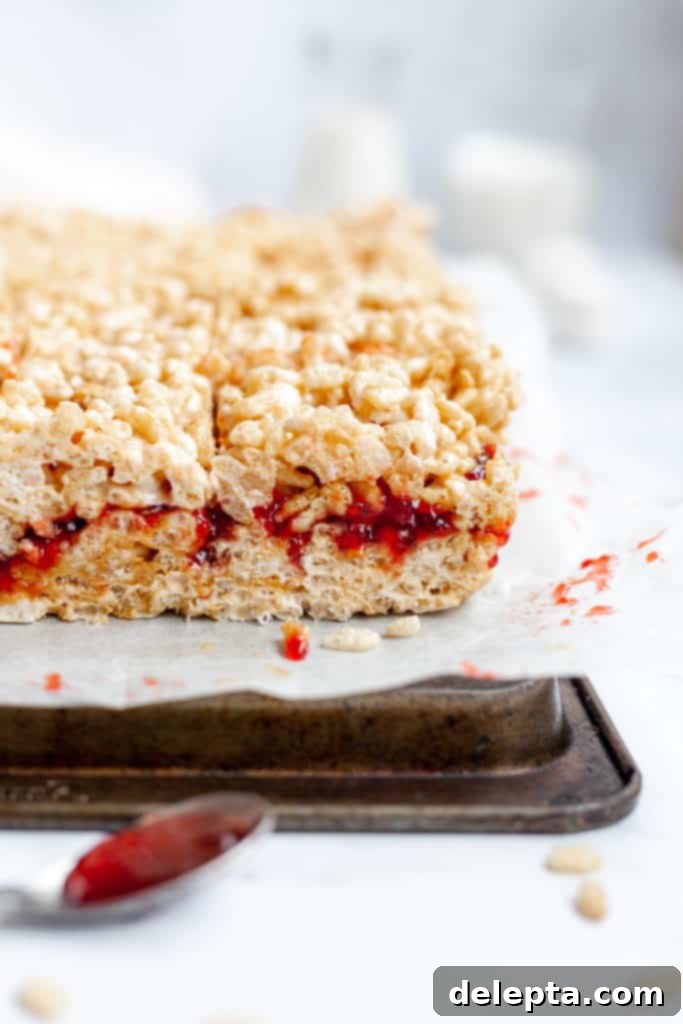 Peanut Butter Jelly Krispie Squares 3 side view of peanut butter and jelly rice krispie treats