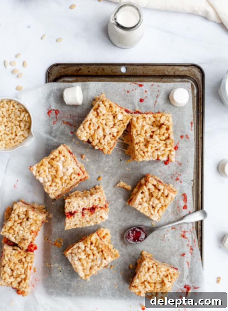 Peanut Butter Jelly Krispie Squares 4 over heat shots of peanut butter and jelly rice krispie treats on an upside down tray