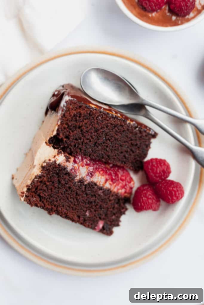 Chocolate Raspberry Drip Cake 4 slice of chocolate raspberry cake on a plate