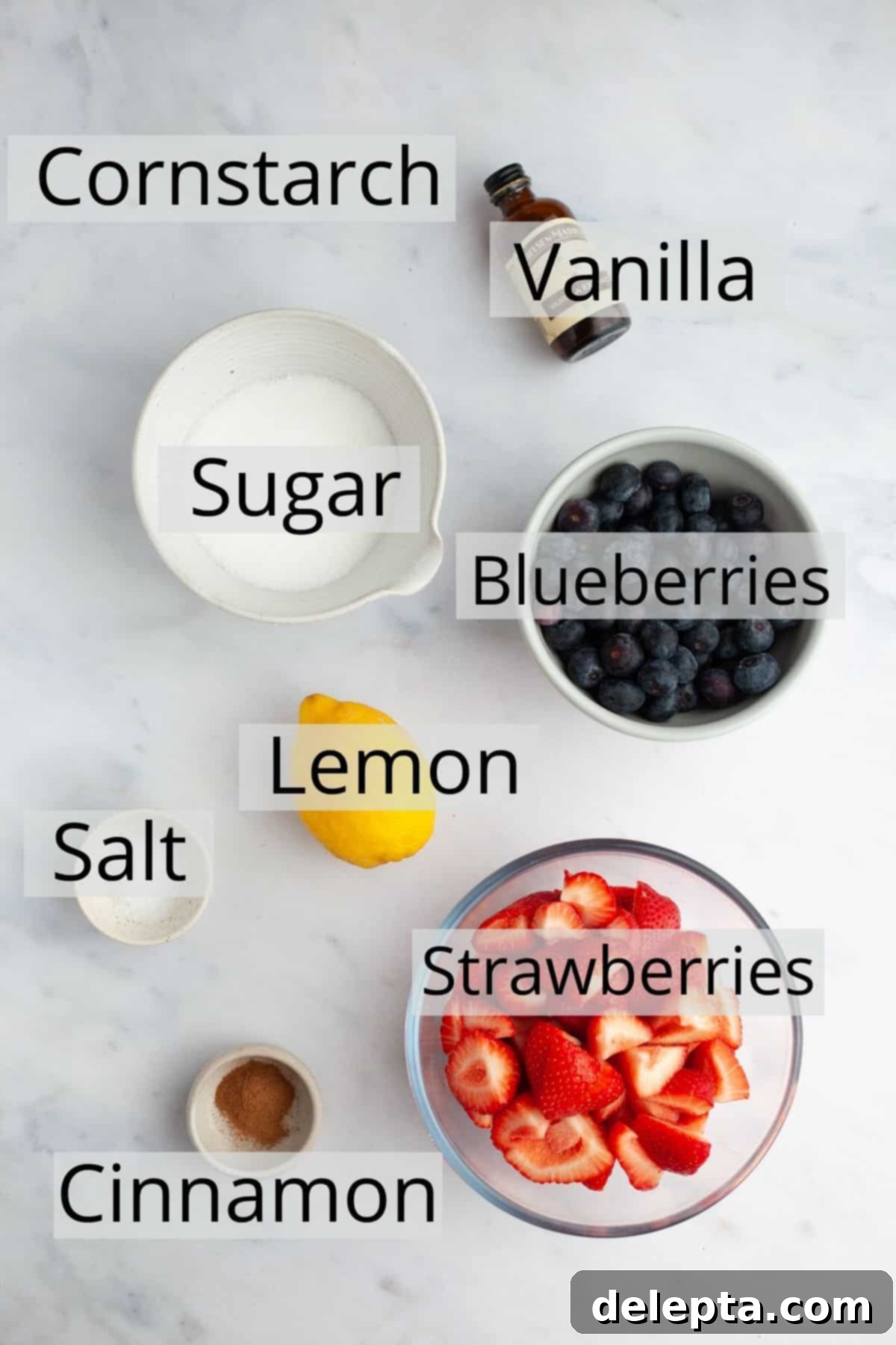 Double Berry Bliss Pie 4 All the vibrant ingredients needed for a strawberry blueberry pie filling weighed out into small bowls, ready for use.