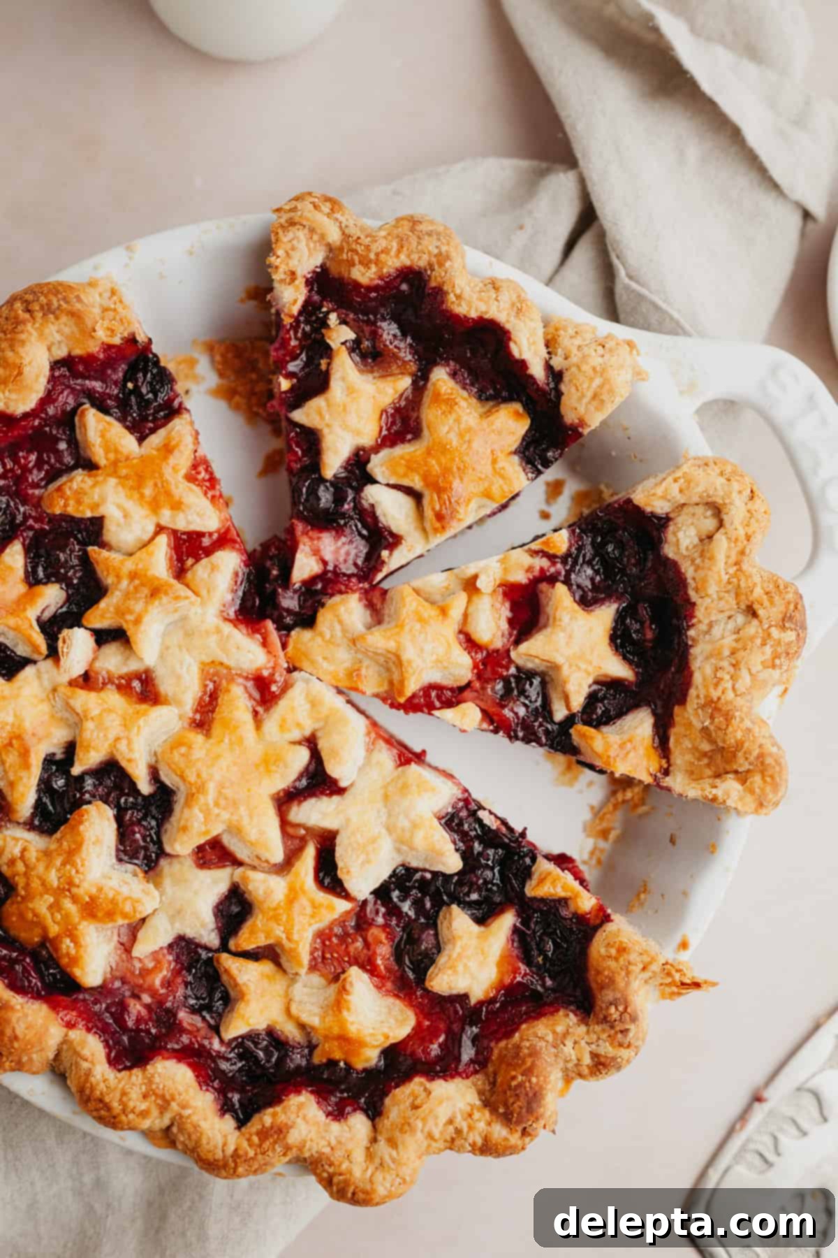 Double Berry Bliss Pie 10 Slices of a perfectly baked strawberry blueberry pie, showing the thick filling and flaky crust.