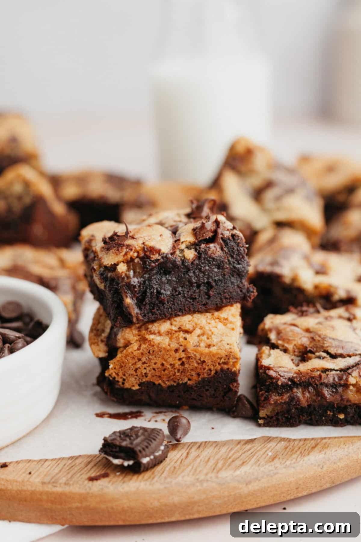 Ultimate Oreo Brookies 2 A close up of two Oreo brookies stacked on top of each other, showcasing their distinct layers and delicious texture.