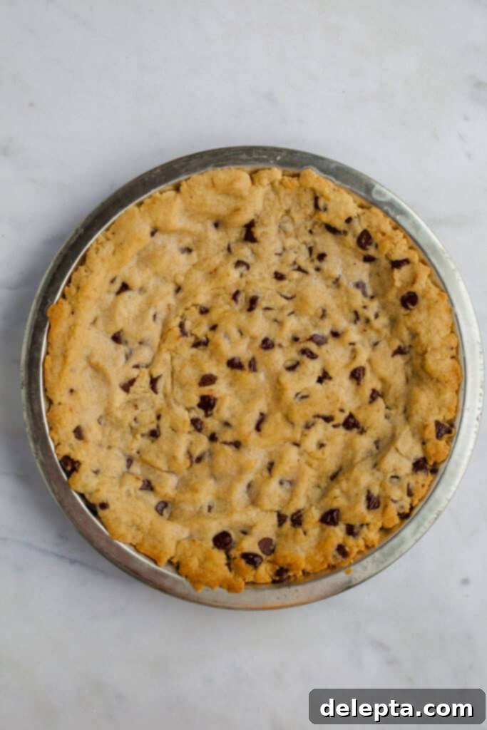 Fudgy Brownie Pie 11 The perfectly par-baked chocolate chip cookie crust, now a beautiful golden hue, resting in its pie plate, completely cooled and ready for the protective egg white wash.