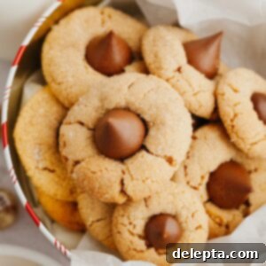 Beloved Hershey's Kiss Thumbprint Cookies 8 Peanut butter thumbprint cookies with Hershey's Kisses beautifully arranged in a tin.