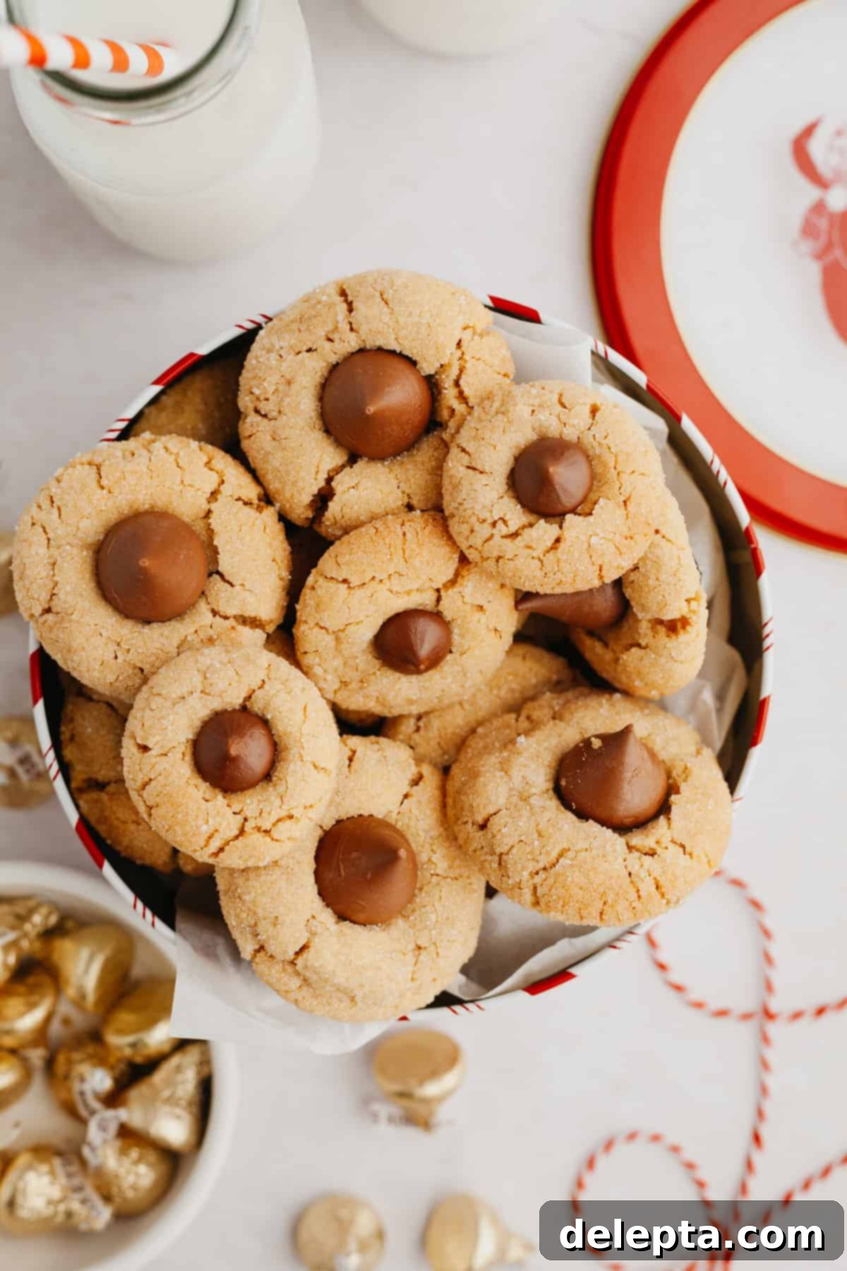 Beloved Hershey's Kiss Thumbprint Cookies 7 An assortment of classic peanut butter thumbprint cookies with Hershey's Kisses, displayed artfully in a tin.