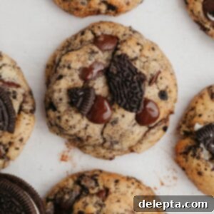 Easy One-Bowl Oreo Chocolate Chip Cookies 9 Oreo chocolate chip cookies on parchment paper.