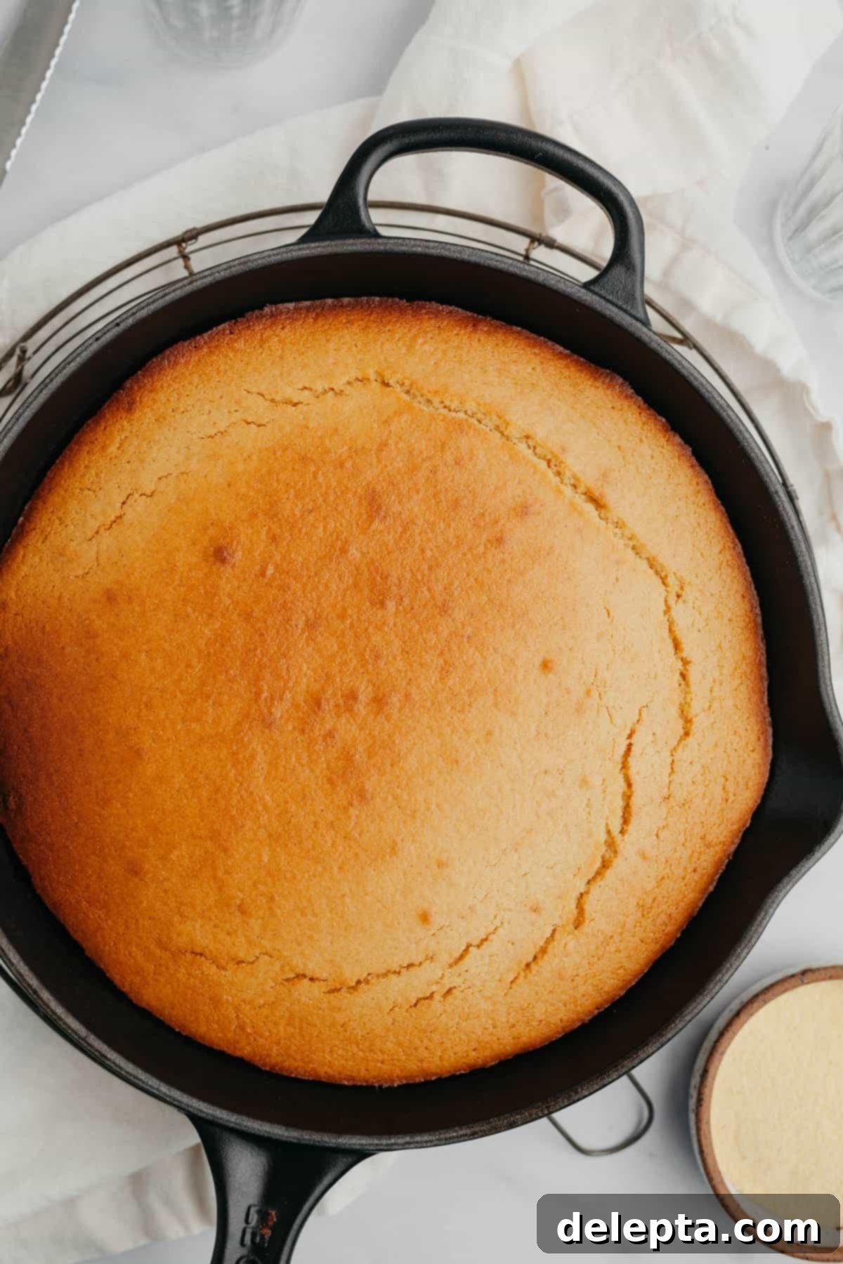 Pantry Staple Cornbread 6 Freshly baked cornbread cooling in a cast iron skillet
