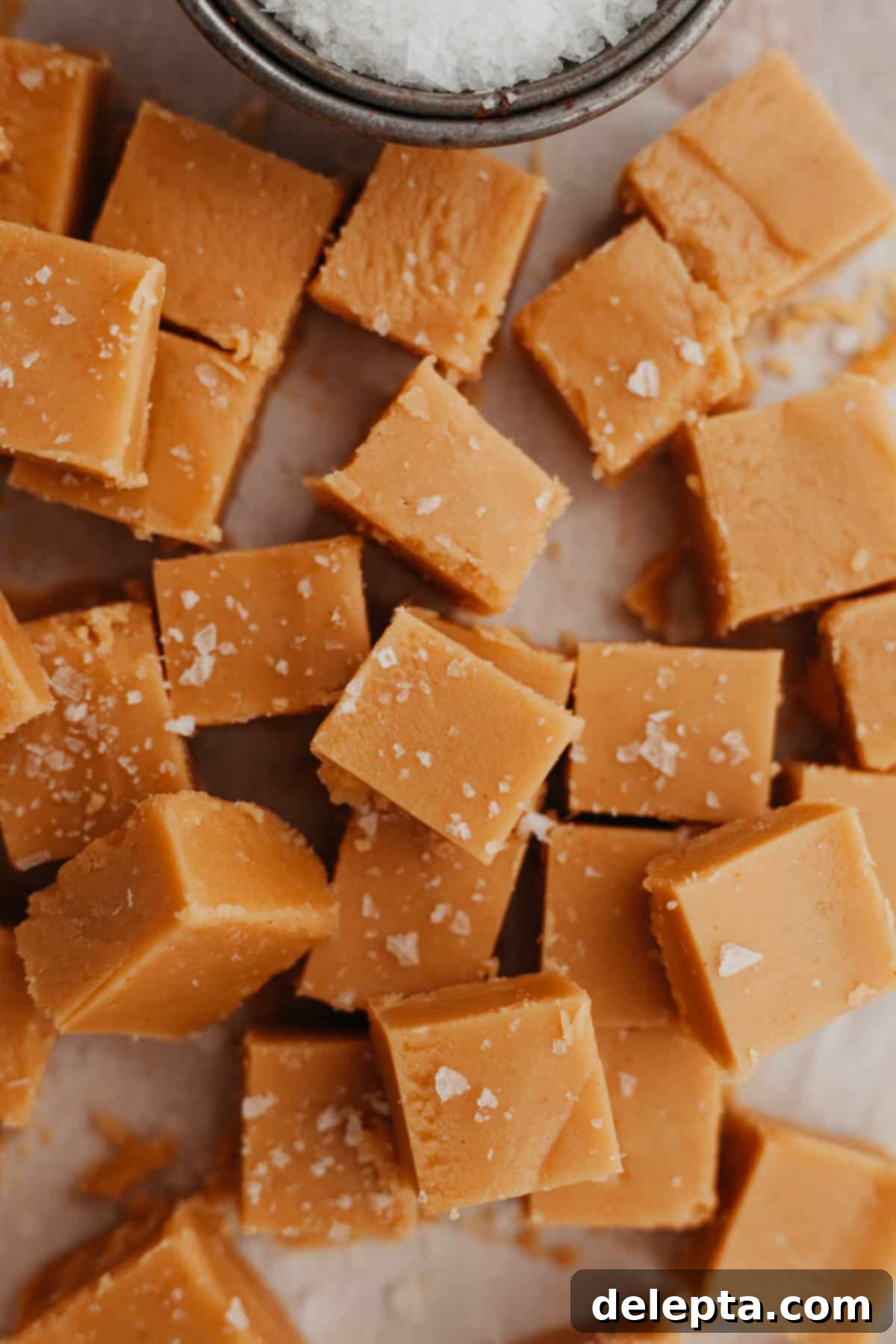 Effortless Peanut Butter Dream 2 A beautiful pile of perfectly cut, golden-brown no-bake peanut butter fudge squares, ready to be enjoyed.