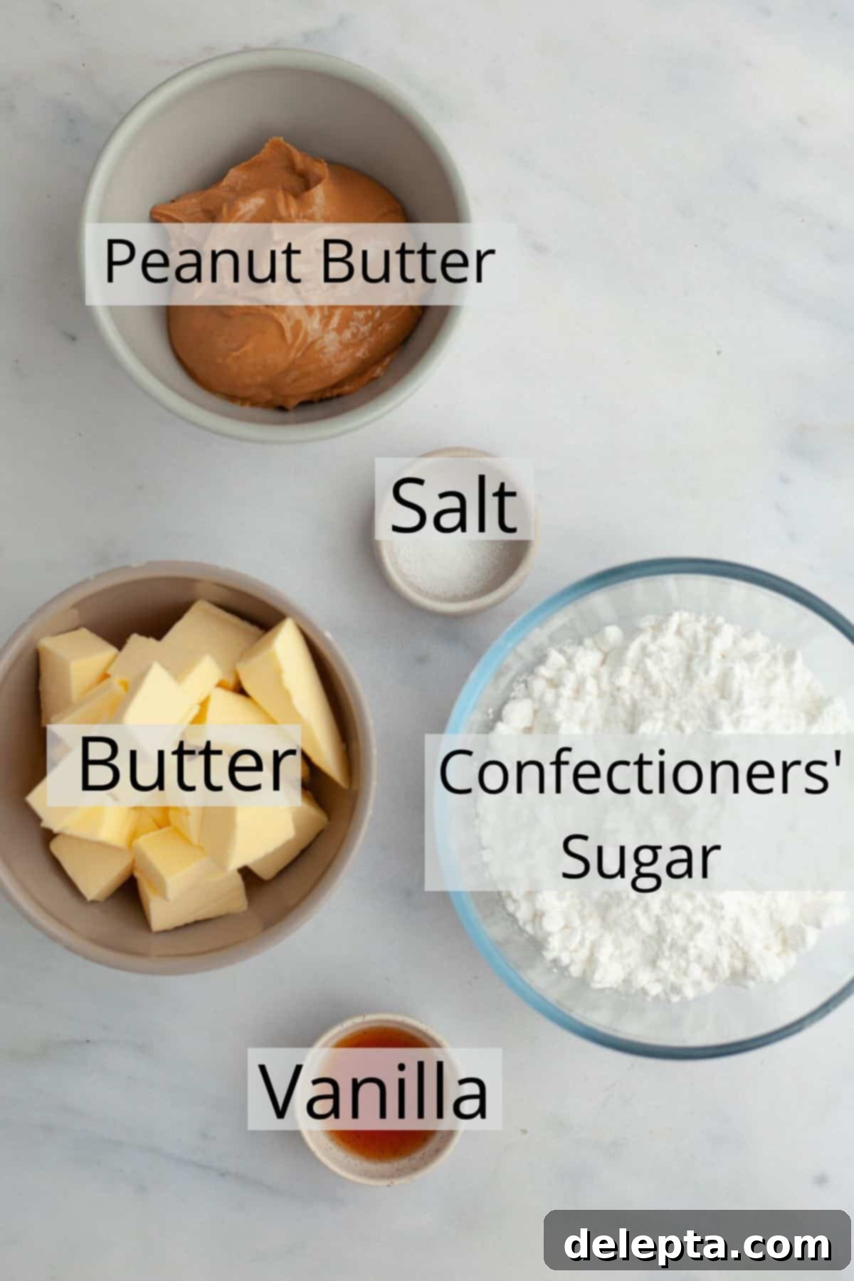 Effortless Peanut Butter Dream 3 All five essential ingredients for no-bake peanut butter fudge neatly arranged in small bowls: creamy peanut butter, cubed unsalted butter, sifted confectioners' sugar, pure vanilla extract, and kosher salt.