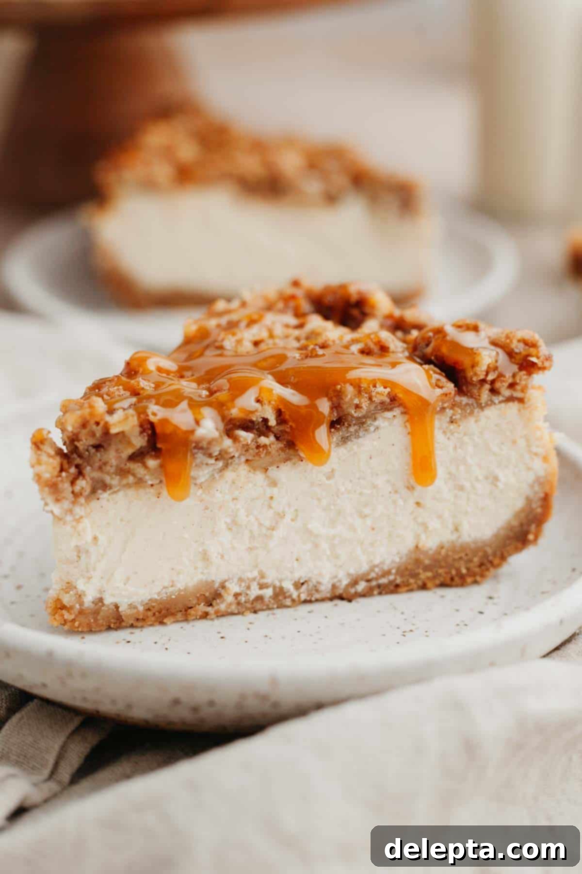 Apple Crumble Cheesecake 2 Cheesecake batter in a large glass bowl, showcasing the creamy texture and readiness for baking.