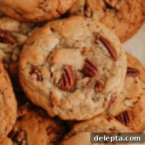Toasted Butter Pecan Gems 9 A pile of browned butter pecan cookies, golden and inviting.