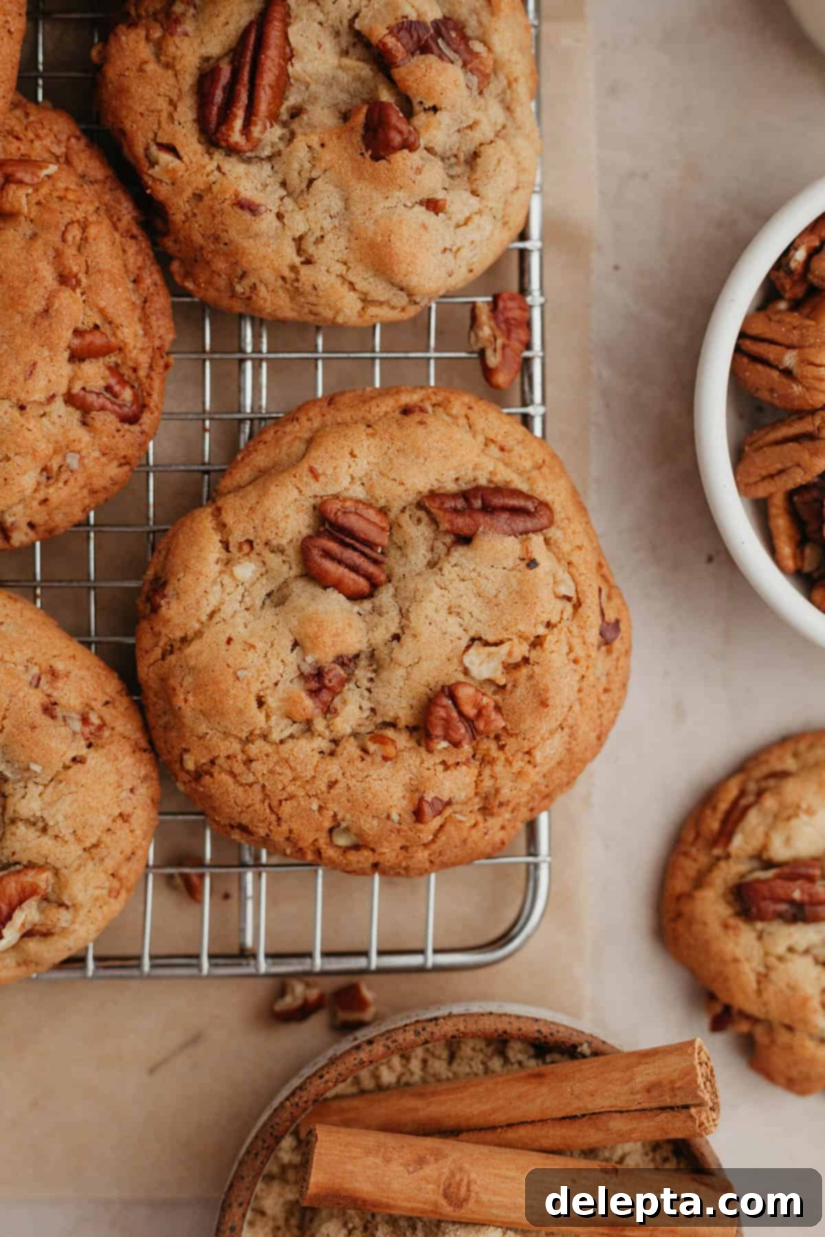 Toasted Butter Pecan Gems 7 Freshly baked brown butter pecan cookies cooling on a wire rack, steam gently rising.