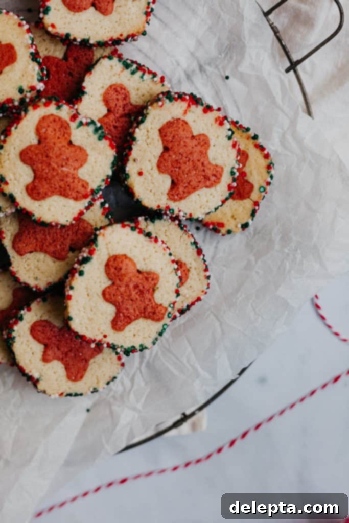 Effortless Holiday Cookie Bliss 4 pile of slice and bake cookies on parchment paper,