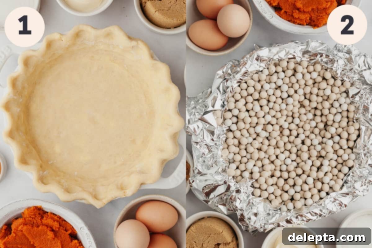 Creamy Pumpkin Dream Pie 4 An unbaked pie crust in a pie dish, covered with foil and filled with pie weights for blind baking.