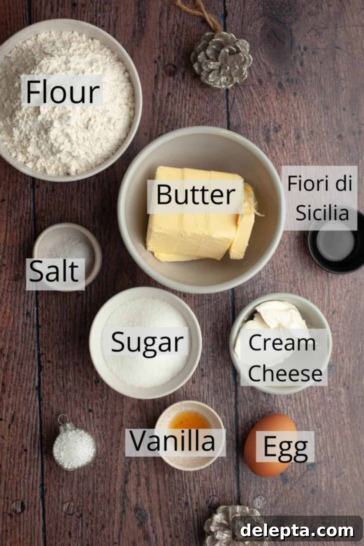 Velvet Cream Cheese Spritz Delights 3 All the measured ingredients laid out in small bowls, ready for making cream cheese spritz cookies.