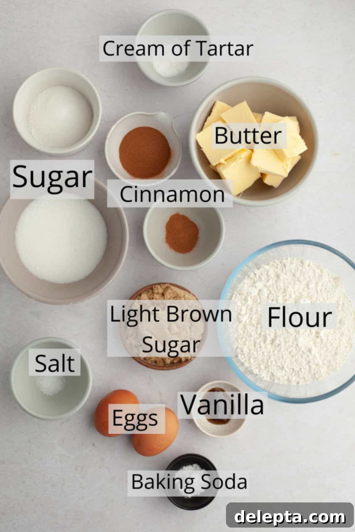 Nutty Brown Butter Snickerdoodles 3 All the measured ingredients for making brown butter snickerdoodles laid out in individual bowls, including flour, sugars, butter, eggs, and spices.