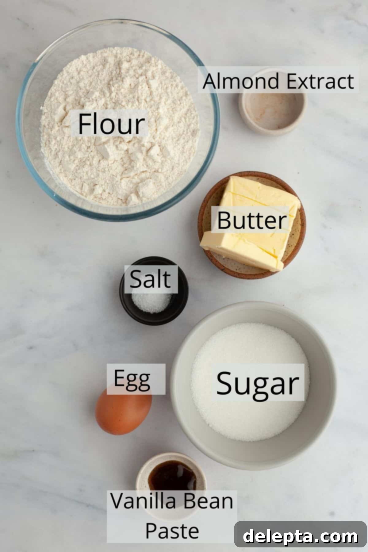 Flawless Cut-Out Sugar Cookies 3 The ingredients needed for no spread sugar cookies carefully weighed out into small bowls, ready for baking.