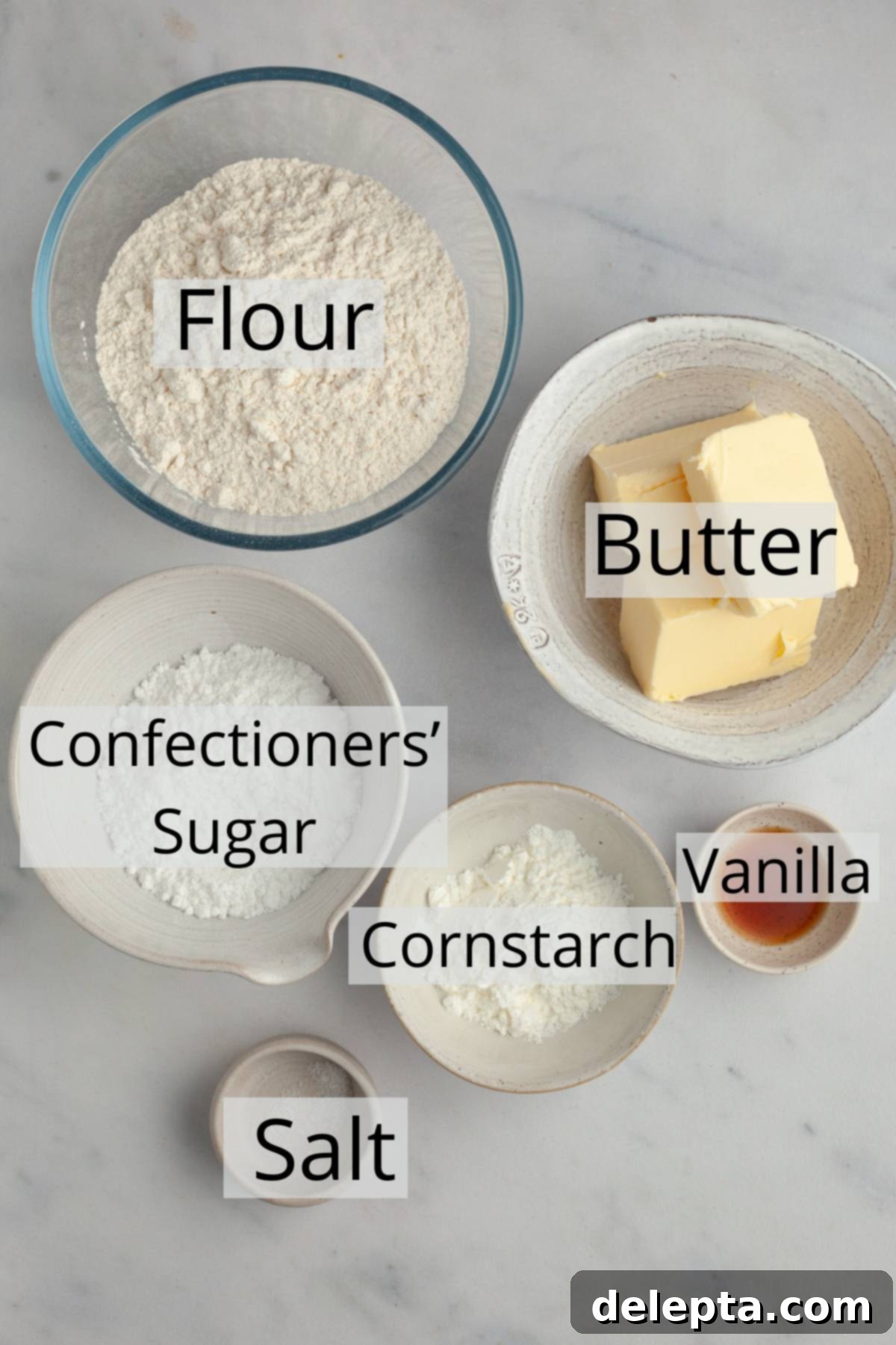 Foolproof Cutout Shortbread Cookies 3 All the core ingredients precisely weighed out into small, individual bowls, ready to be combined for the shortbread cookies.