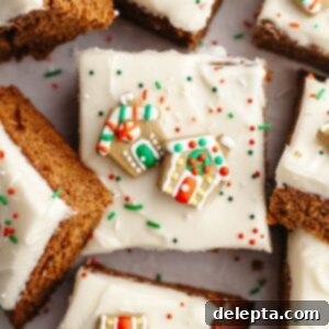 Cozy Gingerbread Cake with Cream Cheese Frosting 12 Square slices of frosted gingerbread cake with Christmas sprinkles.