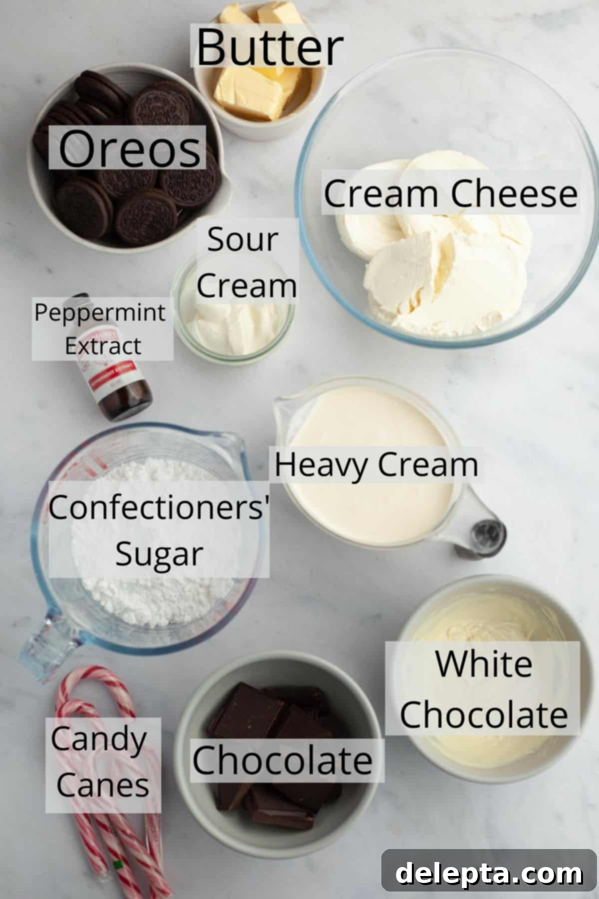 Candy Cane Crunch Cheesecake 3 All the ingredients needed to make a no bake peppermint bark cheesecake weighed out into small bowls, ready for use.