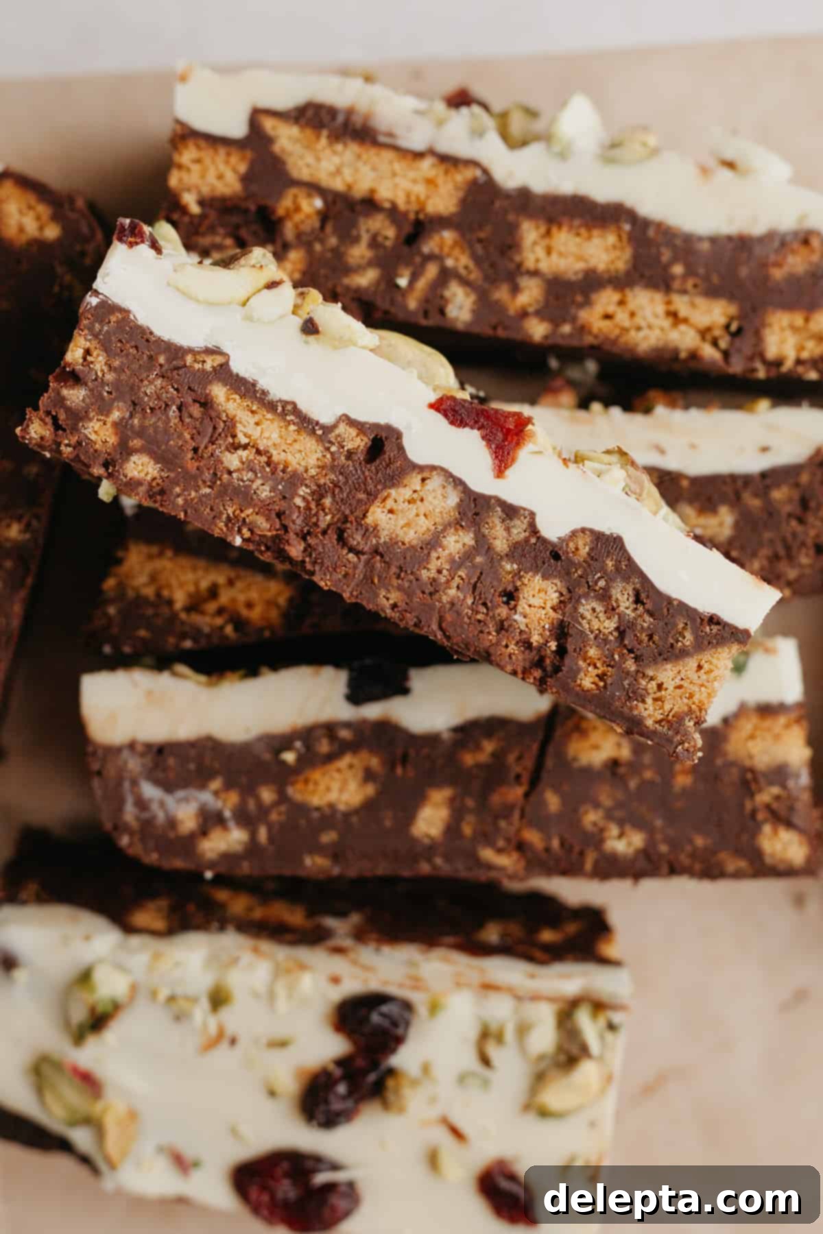 No-Bake Chocolate Biscuit Cake 6 An overhead shot of white and dark chocolate tiffin bars sliced up.