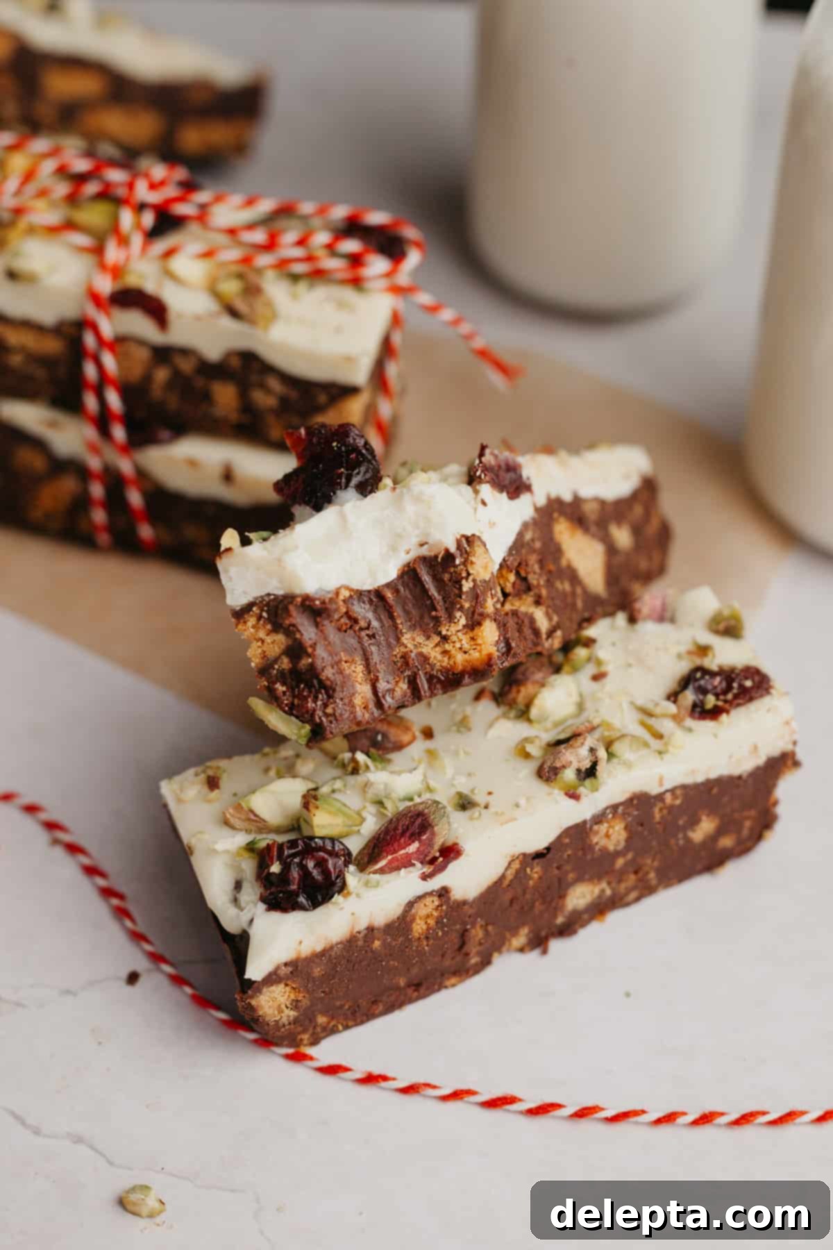 No-Bake Chocolate Biscuit Cake 7 A close up of a tiffin bar with a bite taken out of it.