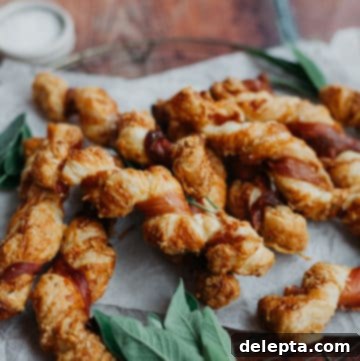 Golden Gruyère, Sage and Prosciutto Puff Pastry Twists 4 overhead shot of puff pastry twists wrapped in prosciutto with sage leaves around the twists