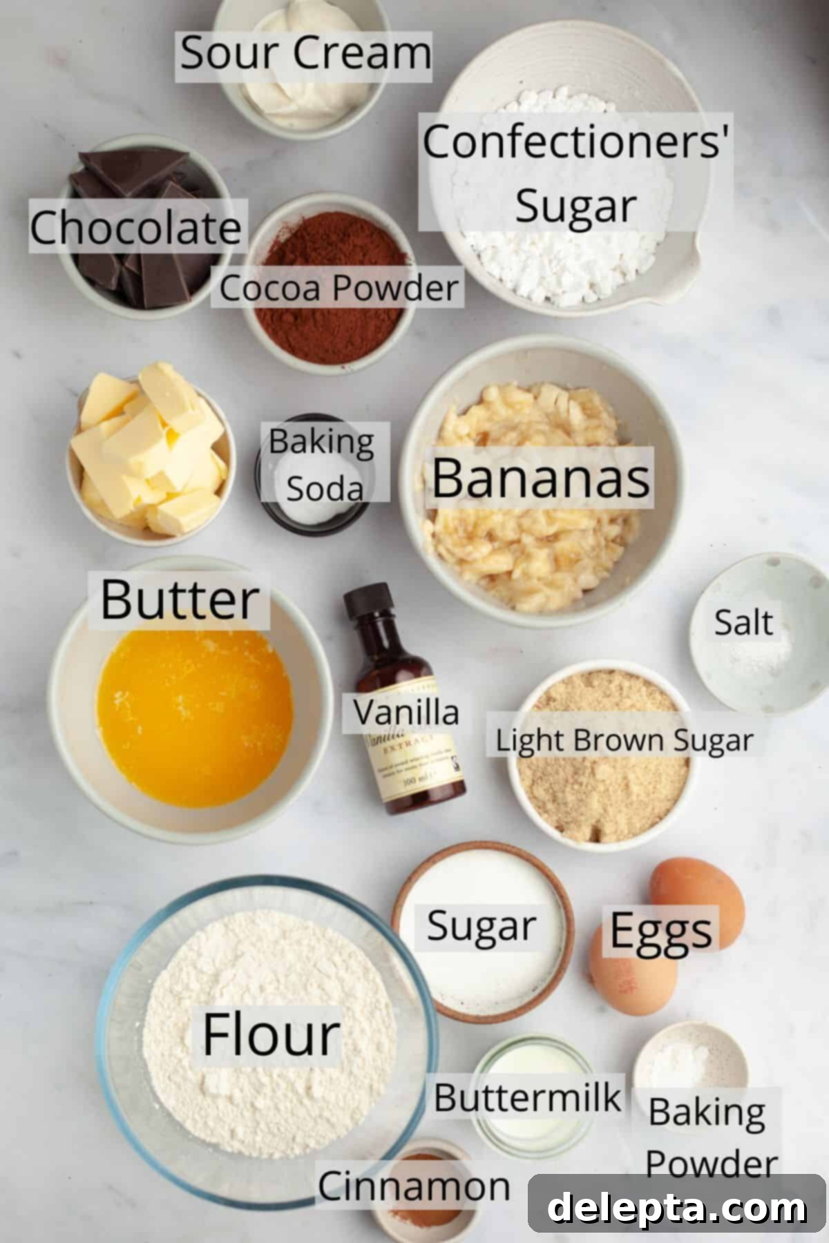 Decadent Banana Chocolate Cake 3 All the dry and wet ingredients needed to make a delicious banana cake with chocolate frosting, precisely weighed out into small bowls.