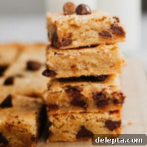 Caramelized Brown Butter Blondies Simple Perfection 8 A stack of 4 chocolate chip brown butter blondies, showcasing their perfect texture.