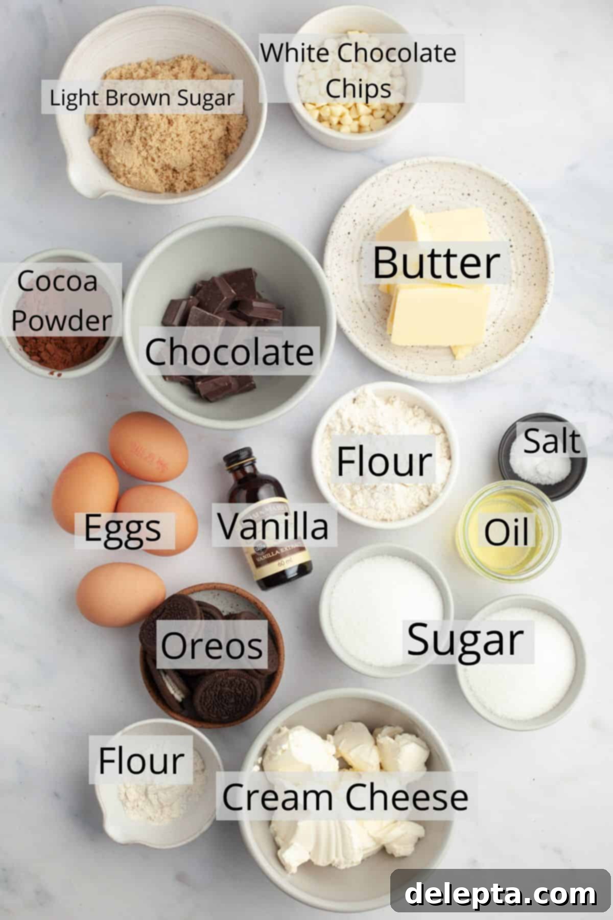 Oreo Cheesecake Swirl Brownies 3 All the ingredients needed to make Oreo cheesecake brownies meticulously weighed out into small bowls, ready for baking.