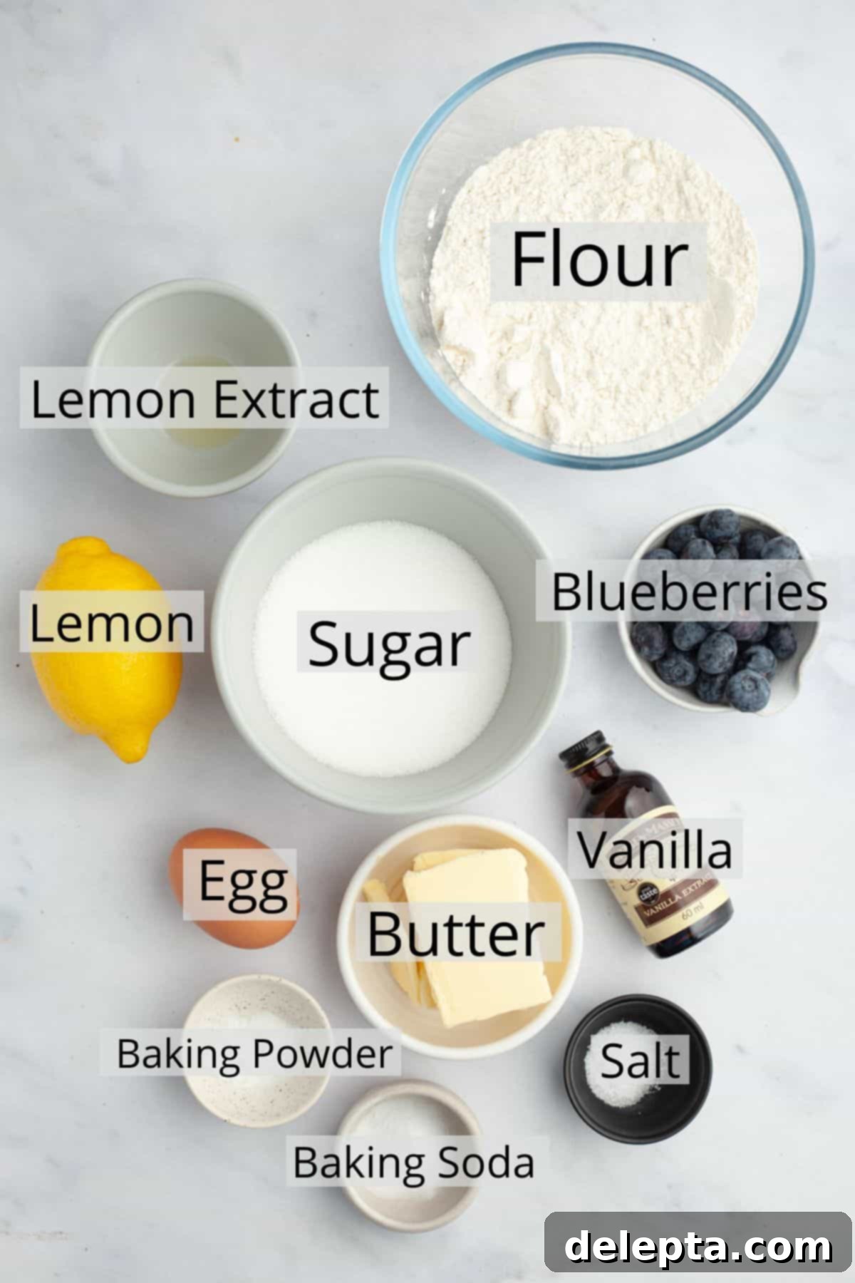 Pillowy Lemon Blueberry Delights 3 All the ingredients needed to make lemon blueberry cookies weighed out into small bowls, ready for baking.