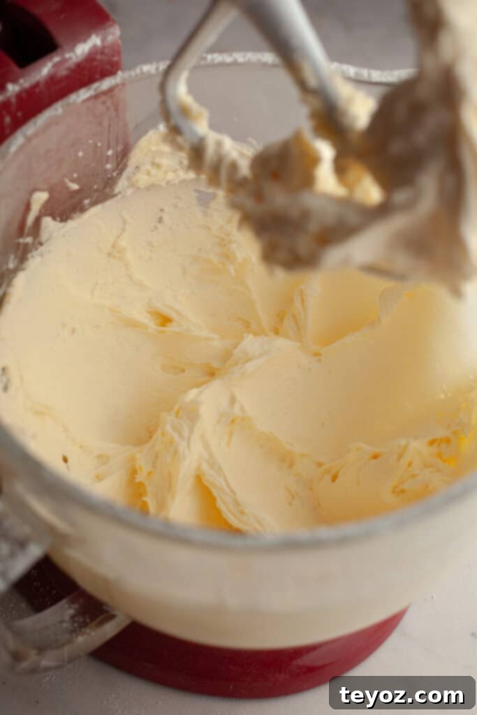 Chocolate Peppermint Dream Yule Log 10 A clear glass bowl showcasing a luscious batch of homemade buttercream.