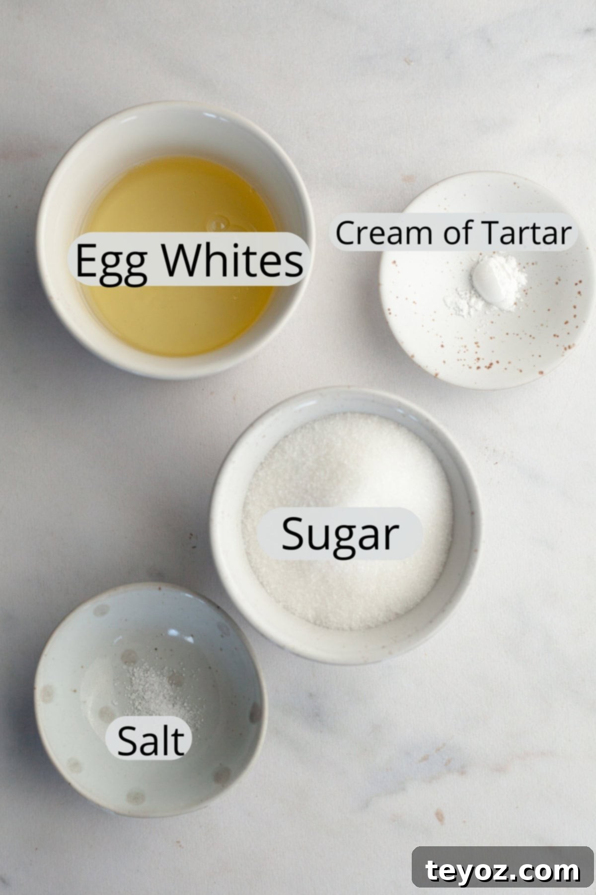The ingredients needed to make meringue mushrooms, weighed out into small bowls.