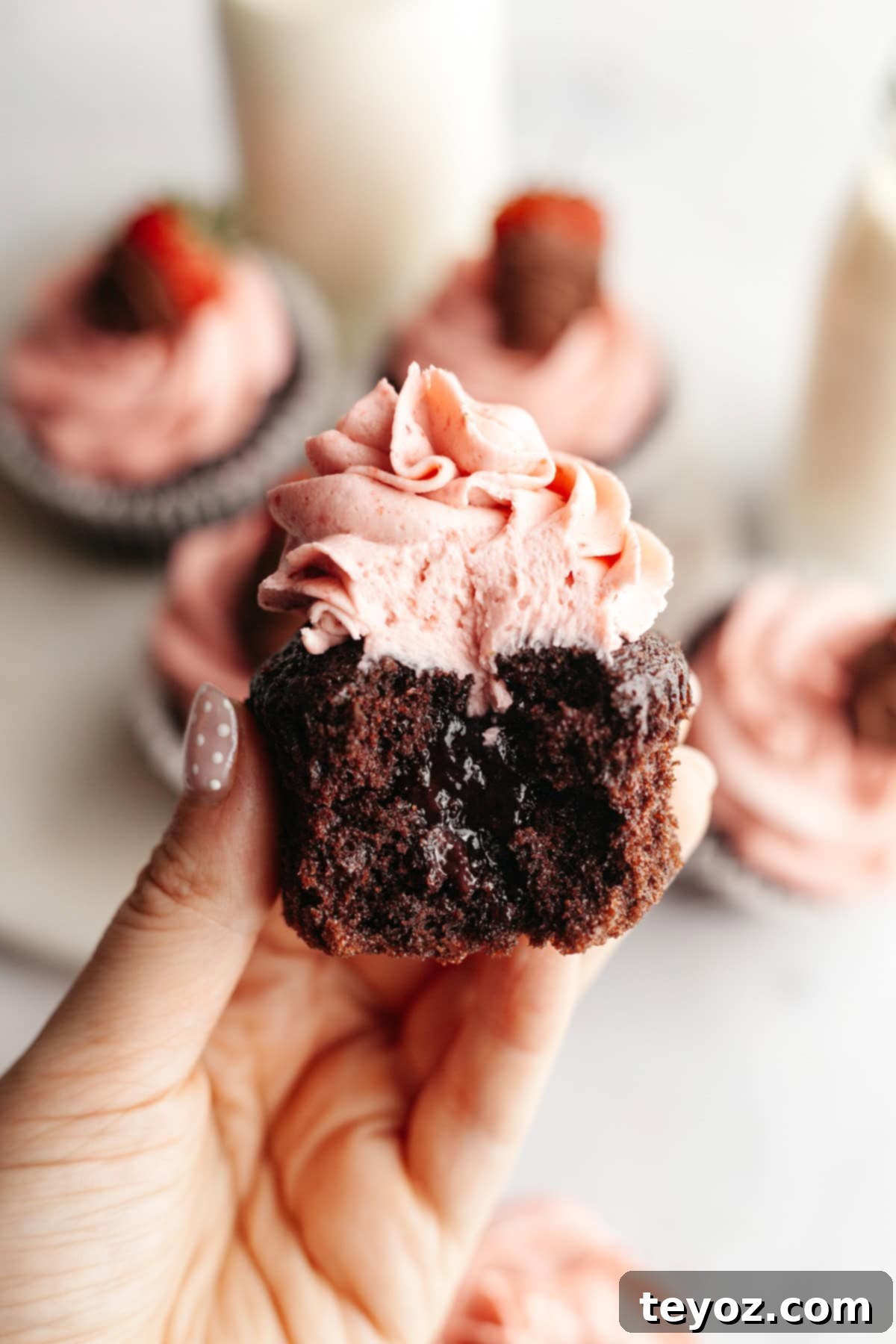 Chocolate cupcake with strawberry buttercream and jam filling