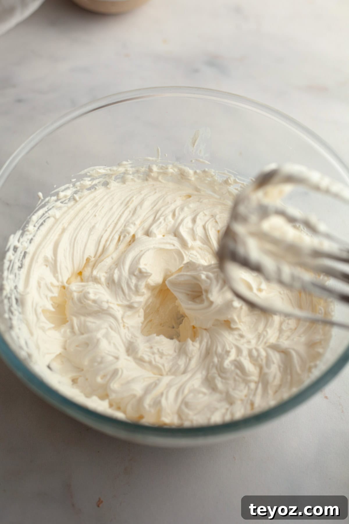 Cream cheese frosting in a bowl