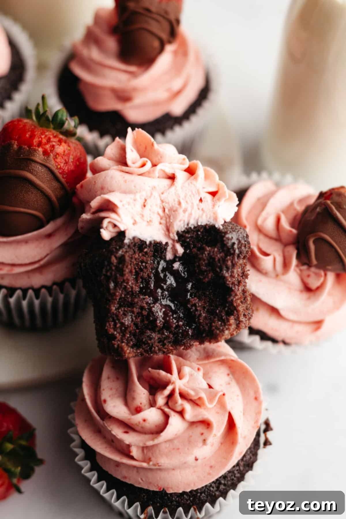 Chocolate cupcake with strawberry frosting and jam